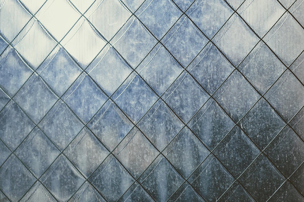 Close-up of a textured metal surface with geometric patterns, captured in Busan, South Korea.