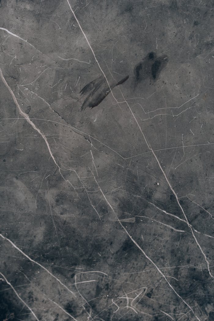 High-resolution close-up of grey marble texture showcasing natural veins and patterns.